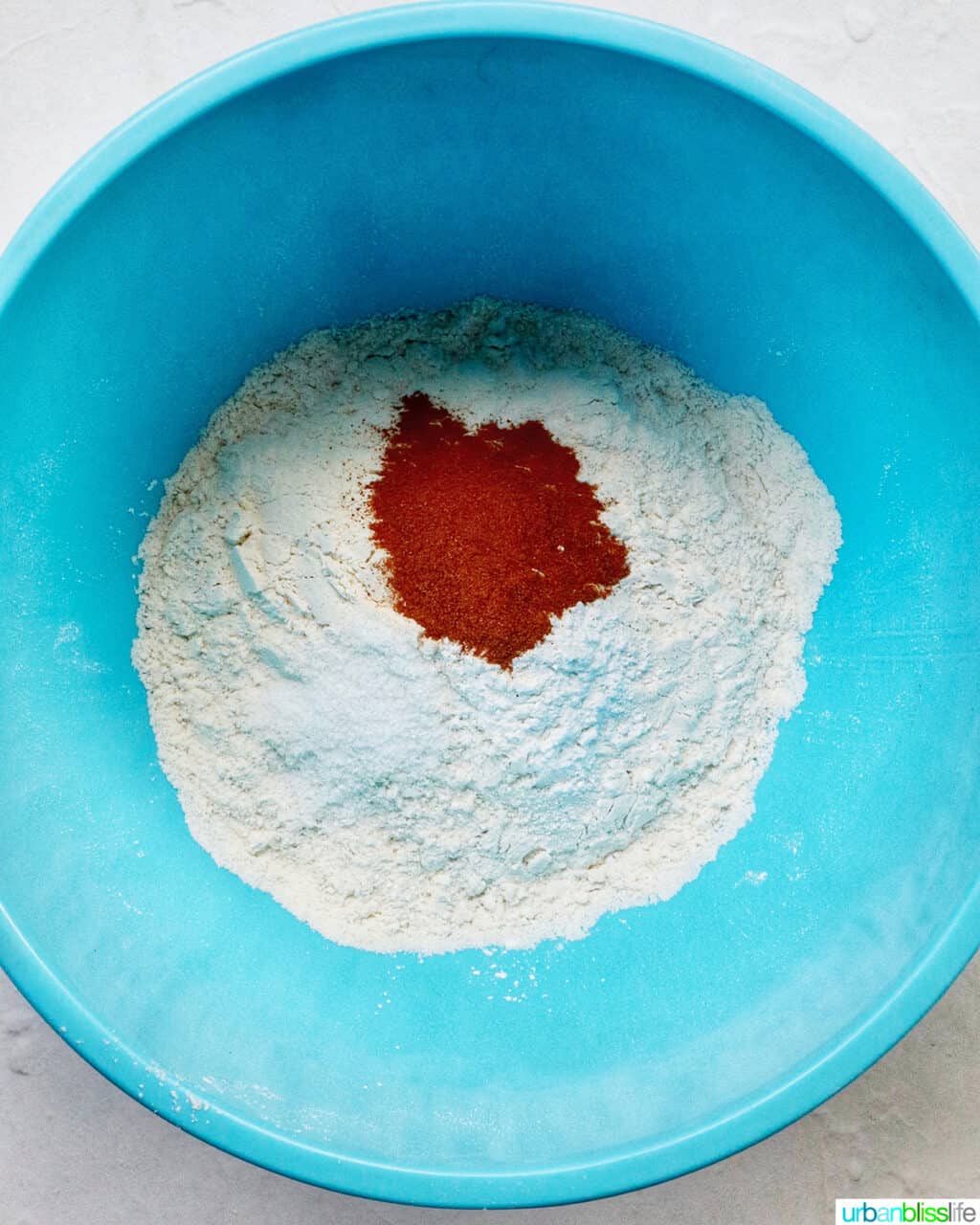 dry baking ingredients in a blue bowl.