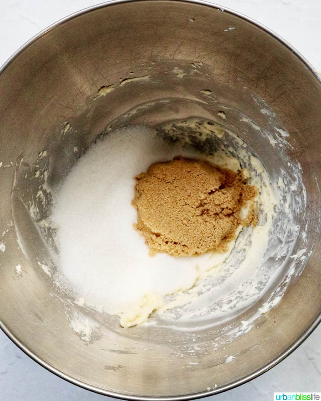 brown sugar and white sugar in a stand mixer bowl.