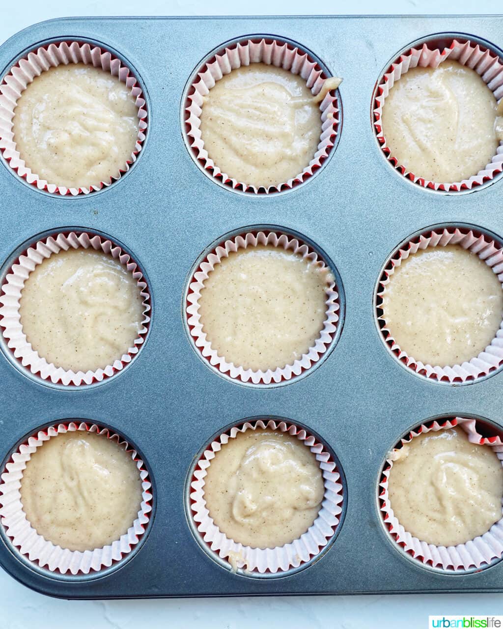 cinnamon cupcake batter in cupcake liners ready to bake.