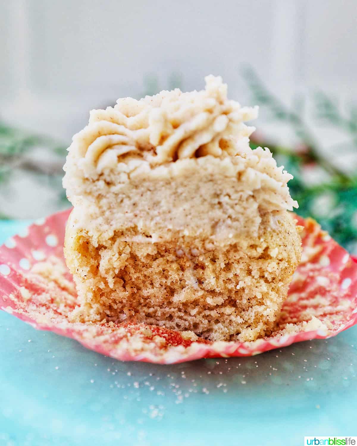 cinnamon cupcake sliced in half with center exposed.