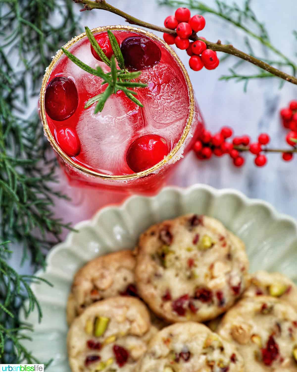 cranberry mocktail with a plate of cranberry pistachio shortbread cookies.