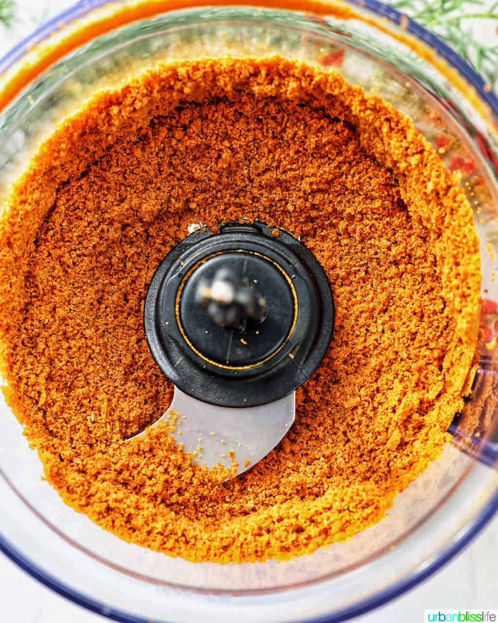 gingerbread cookie crumbles in a food processor.