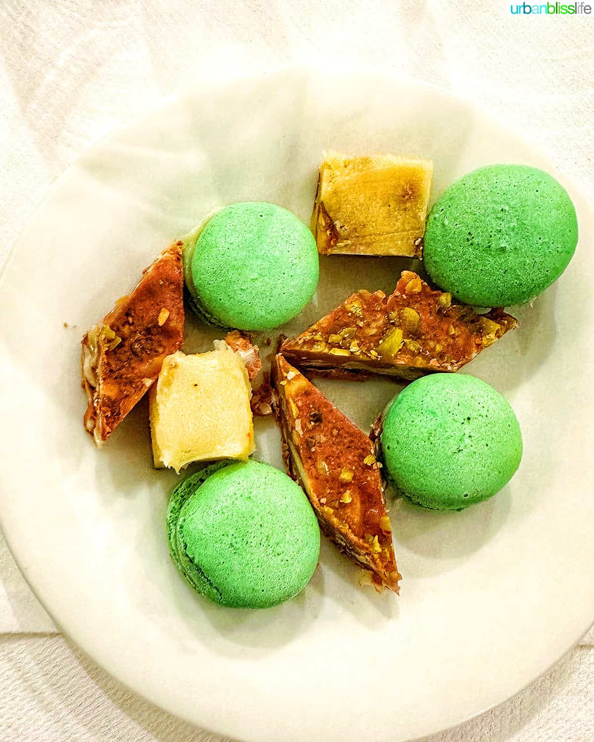 dessert plate with green macarons.