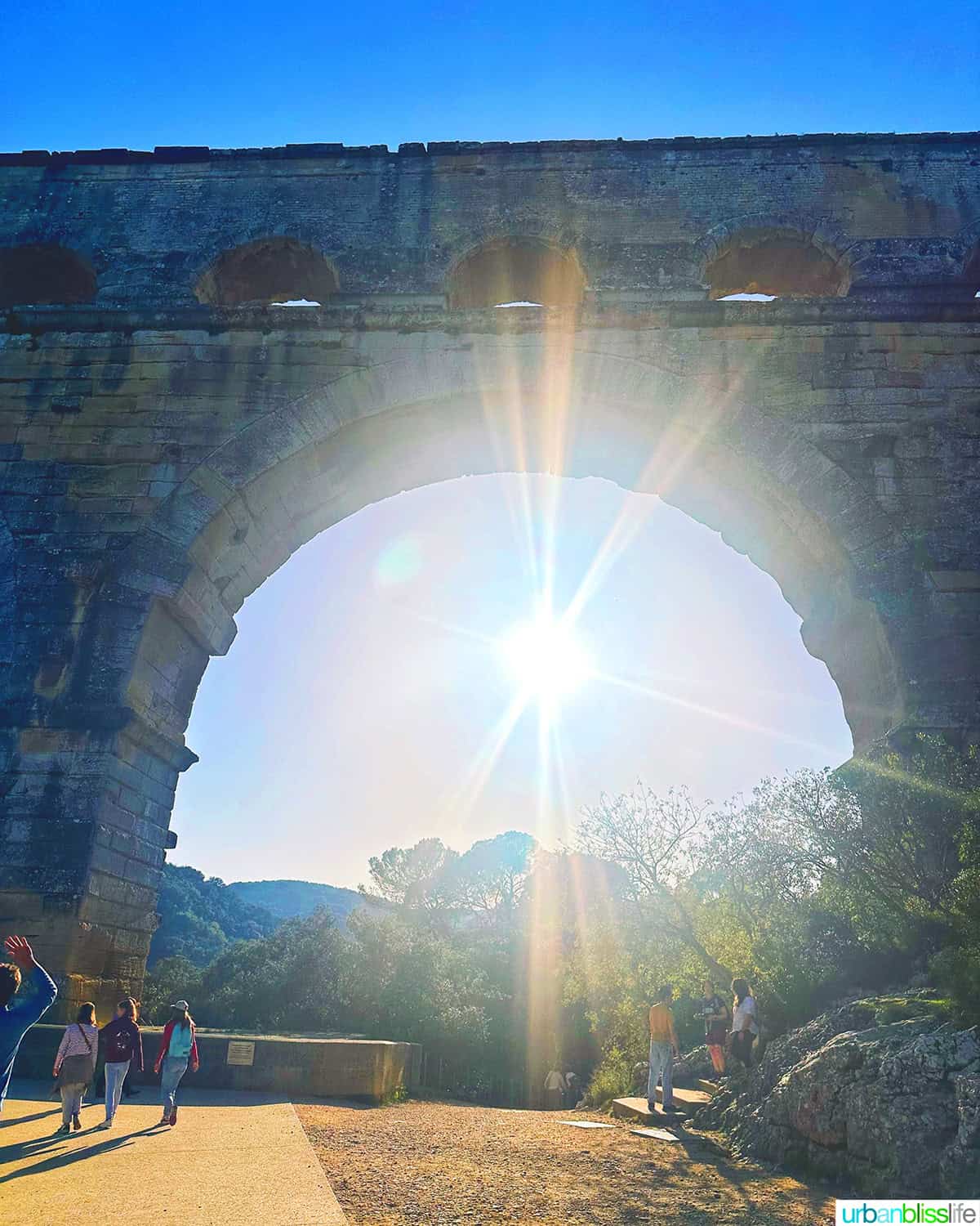 sunshine through arch at pont du gard