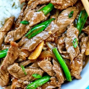 bowl of beef and onion stir fry.