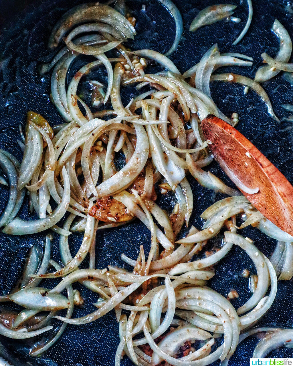sliced onions in a pan.