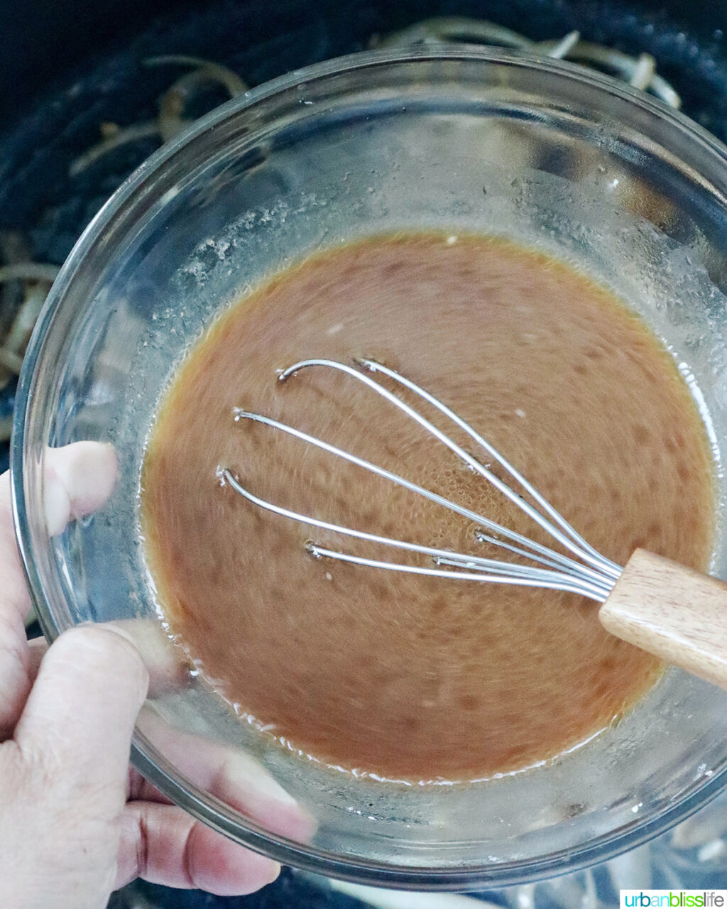whisk and stir fry sauce in a bowl.