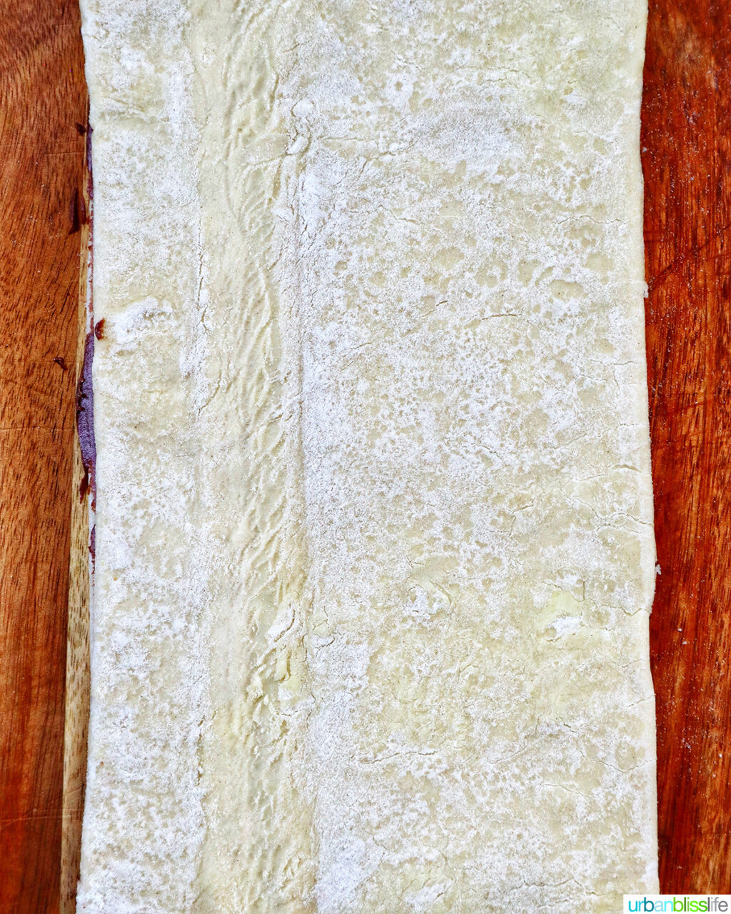 puff pastry dough on a cutting board.