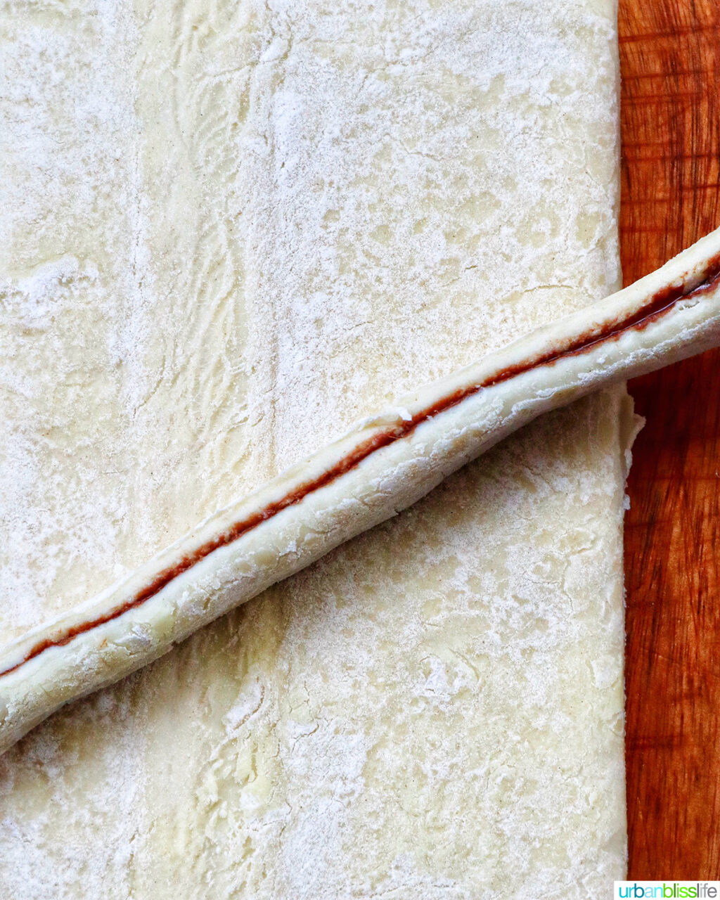 strip of puff pastry on a cutting board.