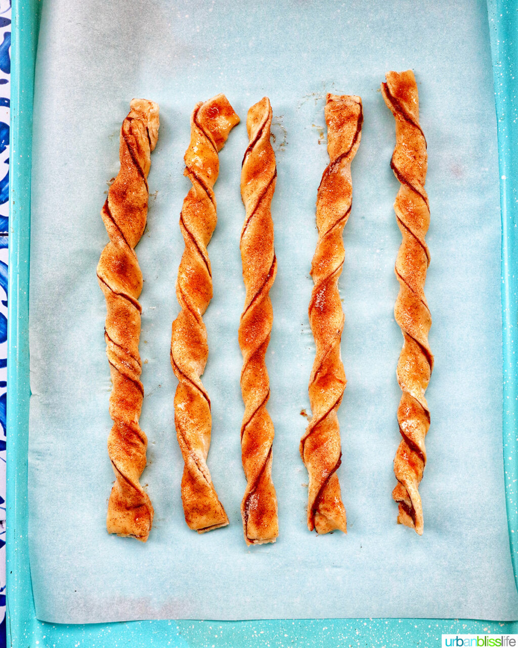 puff pastry chocolate twists on a baking sheet.
