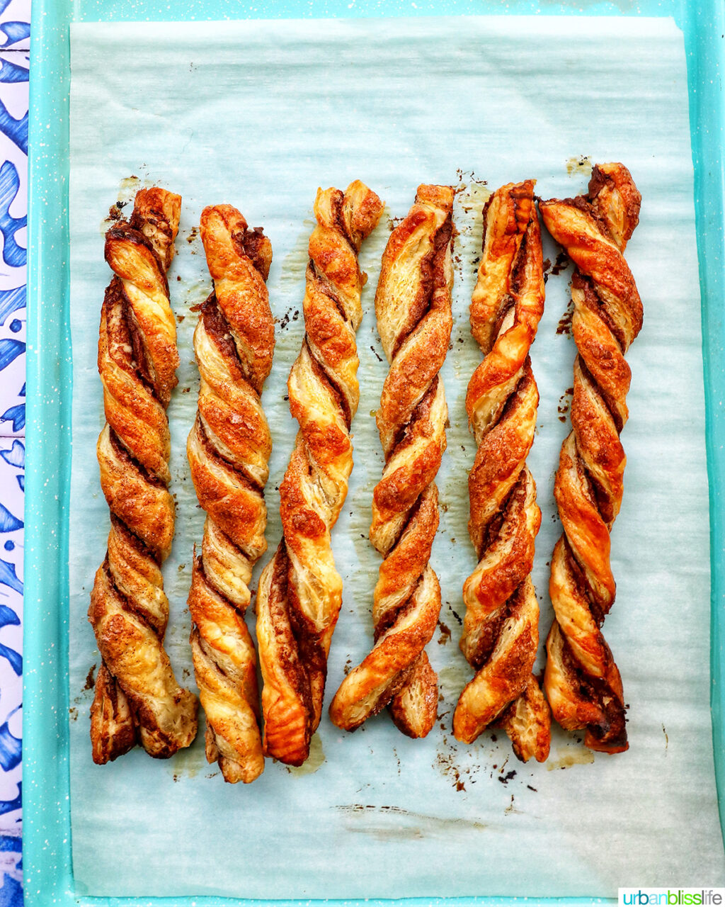puff pastry chocolate twists on a baking sheet.