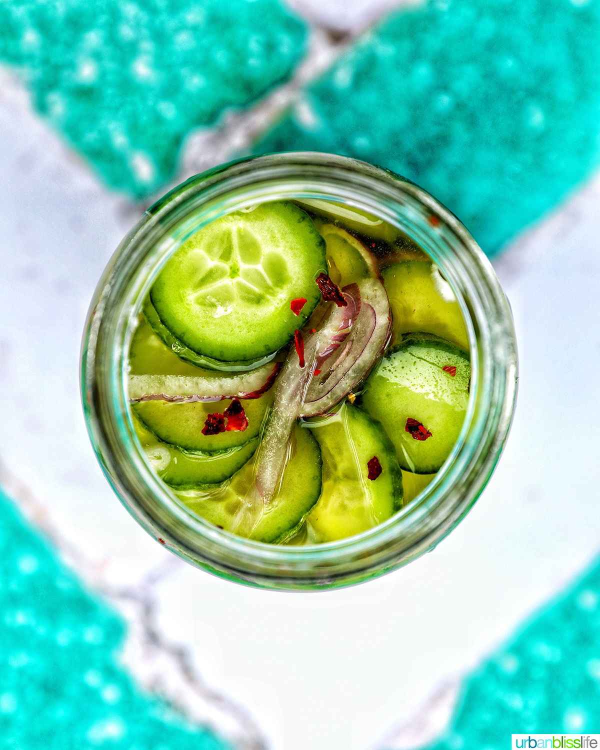 overhead shot of a jar of Asian pickled cucumbers.