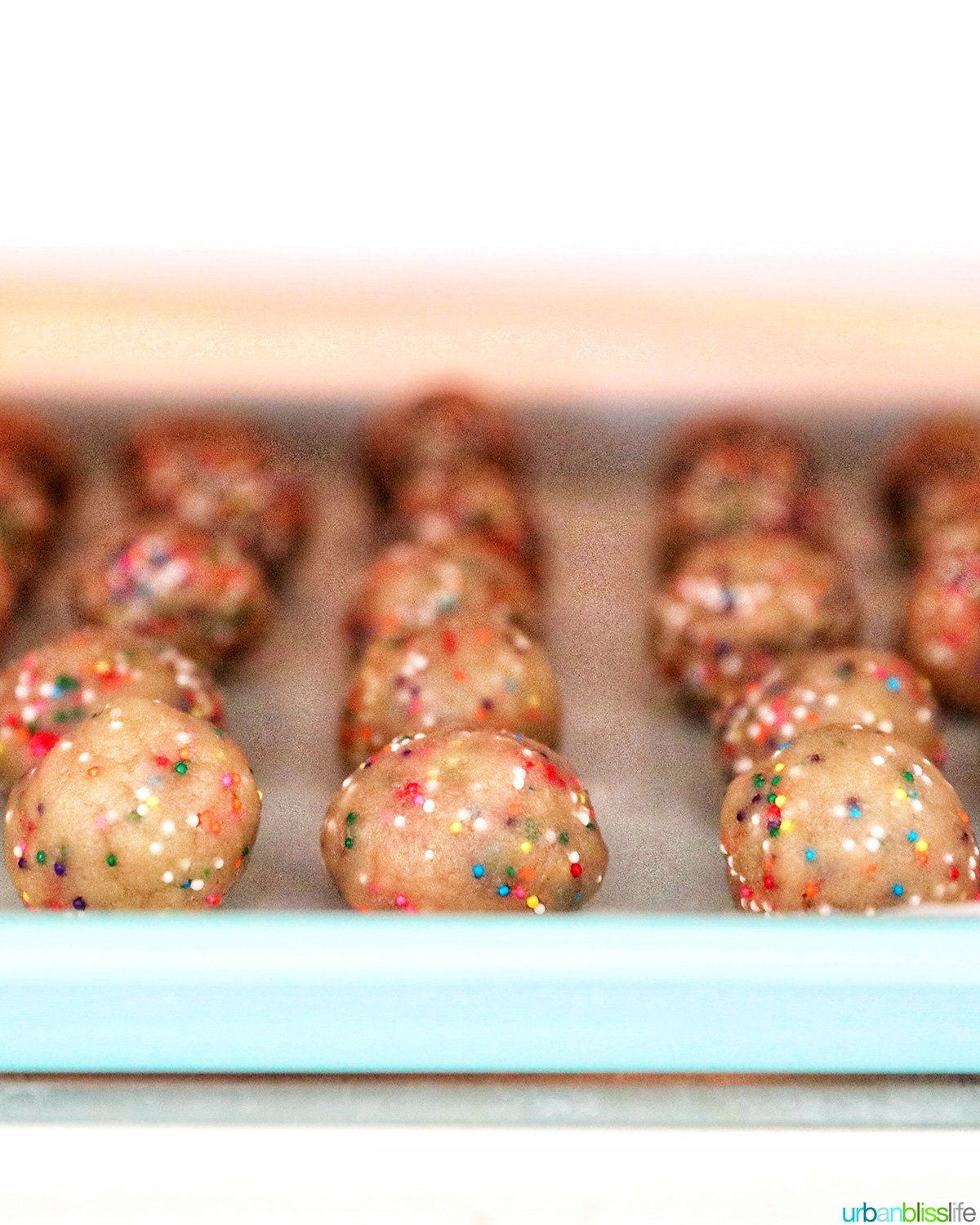 baking sheet of birthday cake truffle dough in the refrigerator.