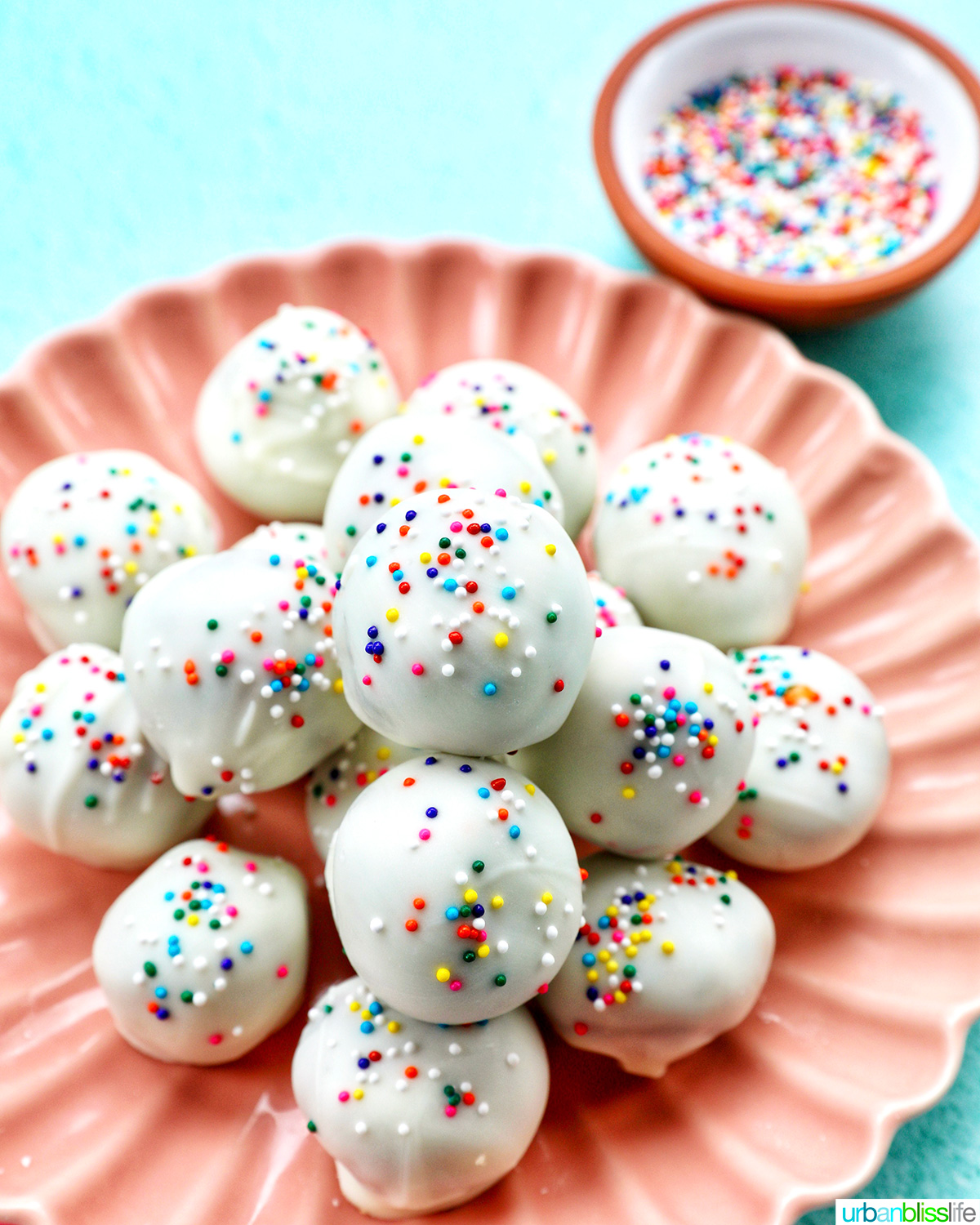 plate of colorful birthday cake truffles.