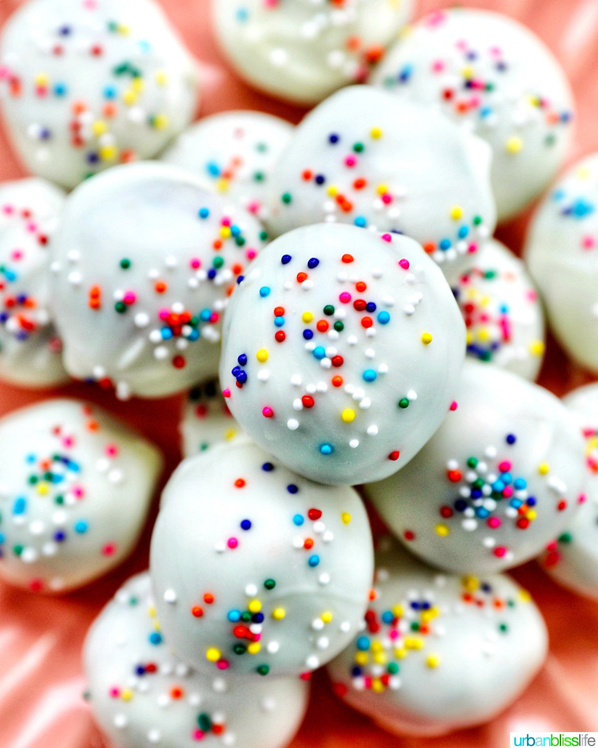 plate of colorful birthday cake truffles.