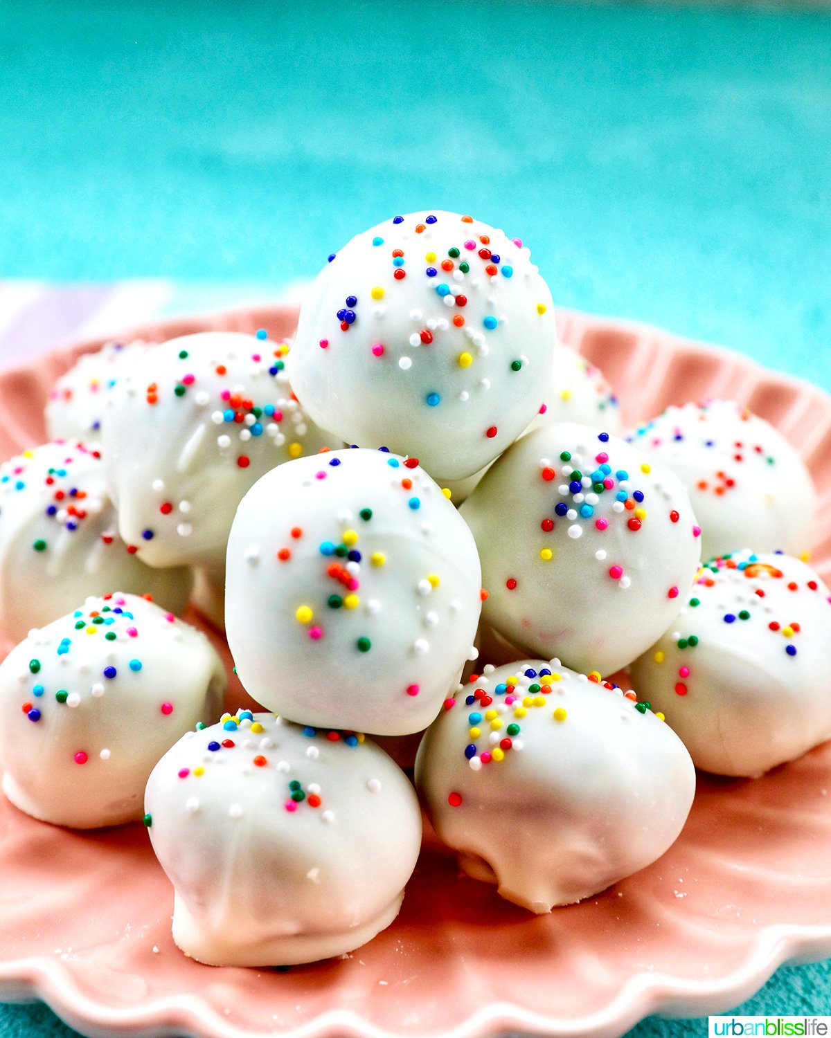 plate of colorful birthday cake truffles.