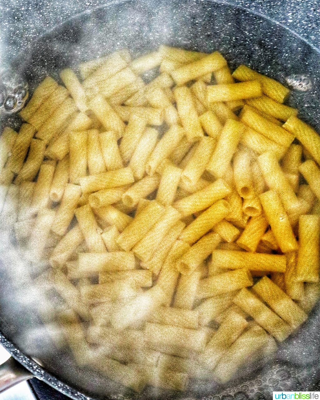 rigatoni pasta in boiling water.
