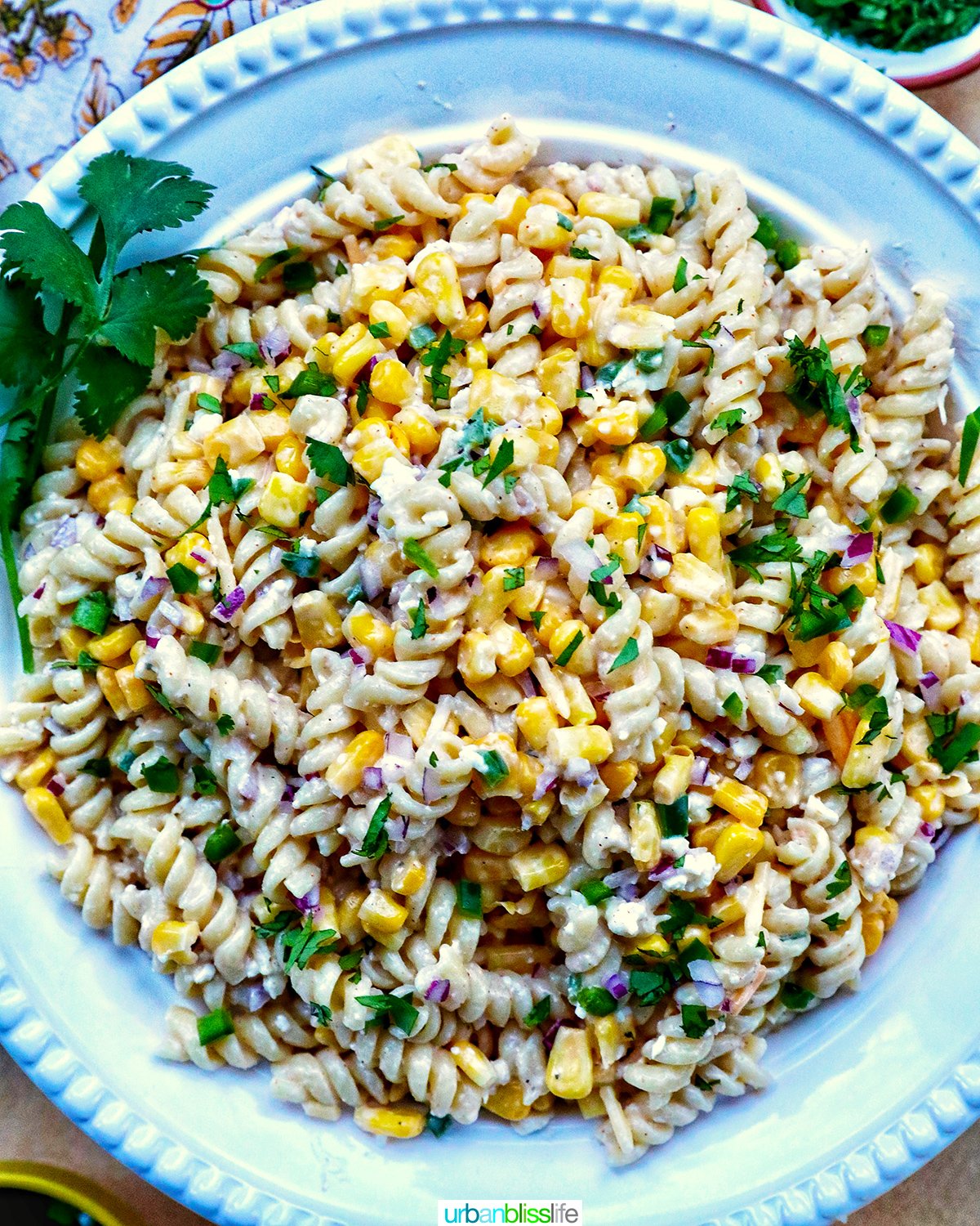 Mexican street corn pasta salad in a white bowl.