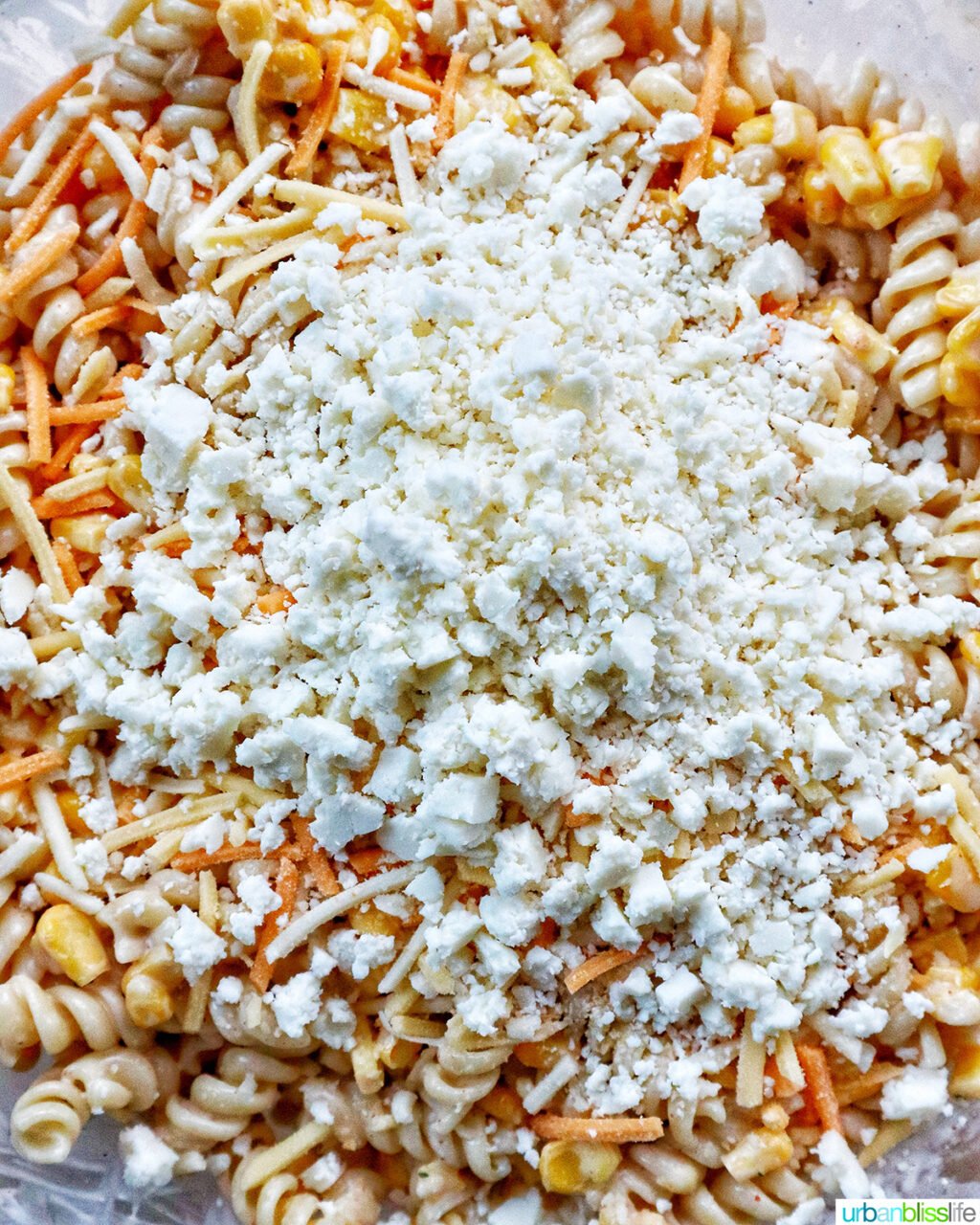cotija cheese added to Mexican street corn pasta salad