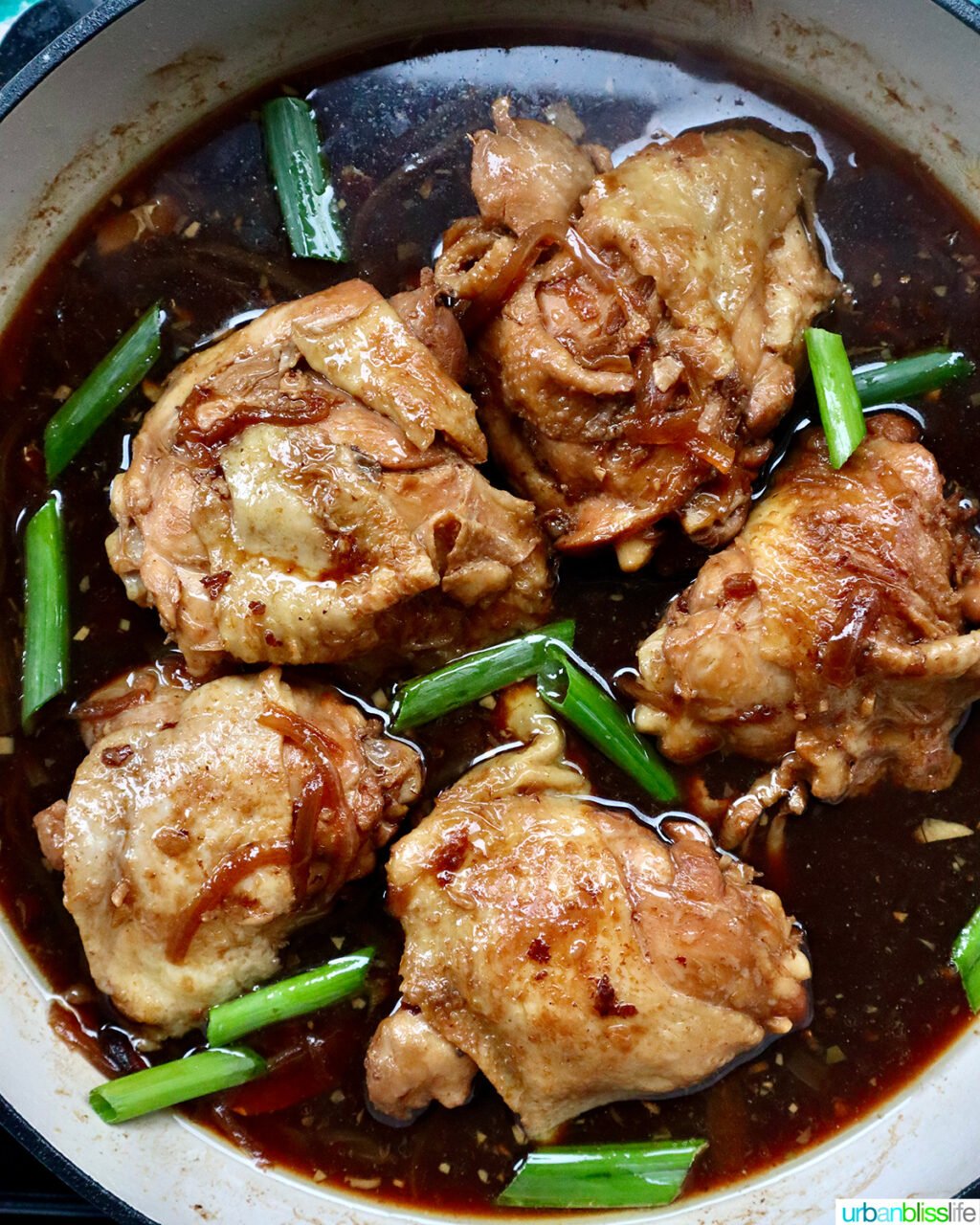 Chinese Braised Chicken cooking in a large skillet.
