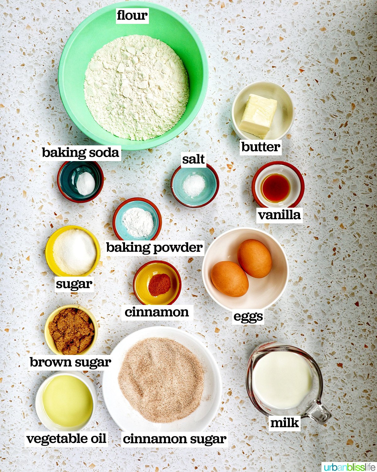 bowls of ingredients to make churro donuts.