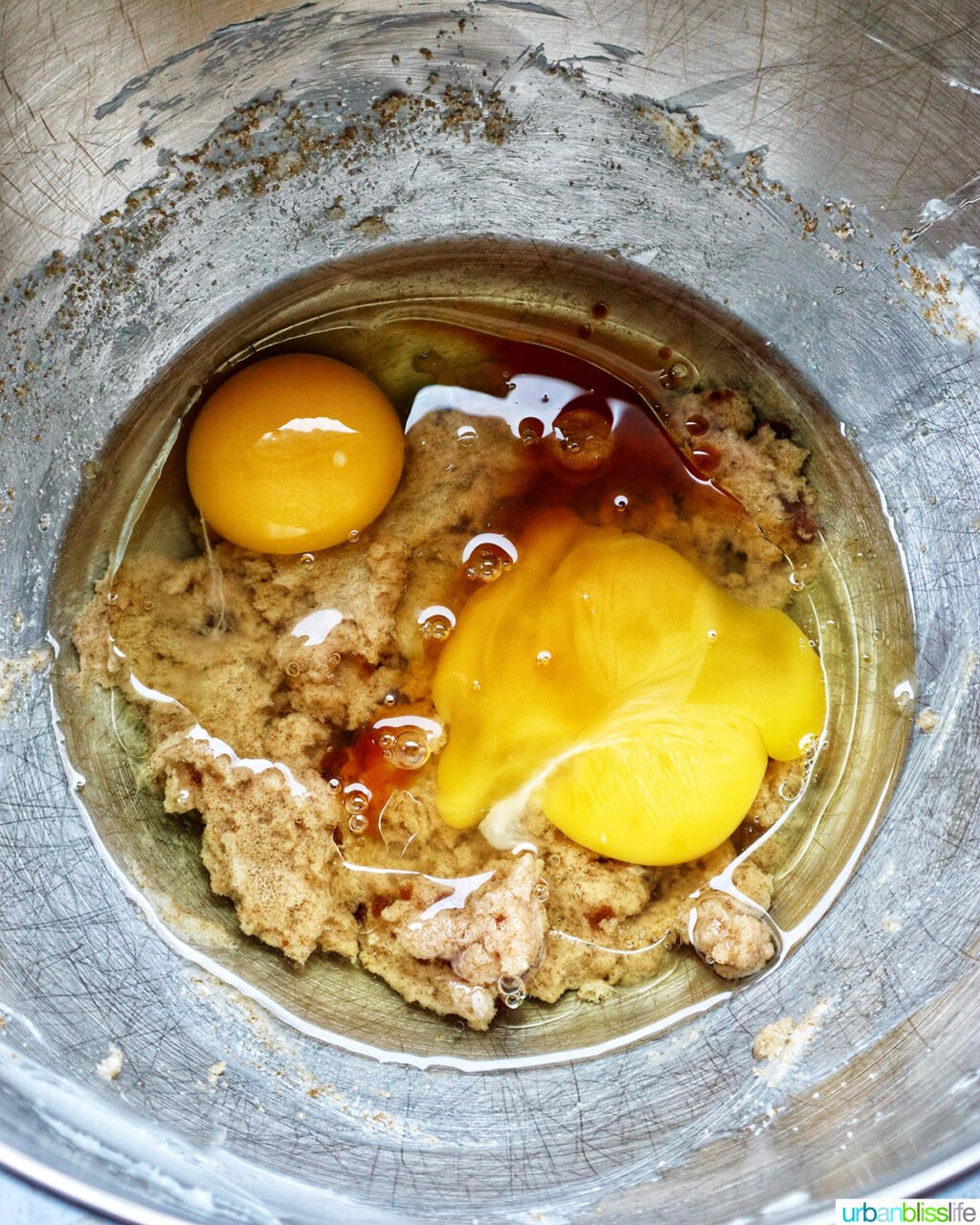 eggs and vanilla in a stand mixer bowl.