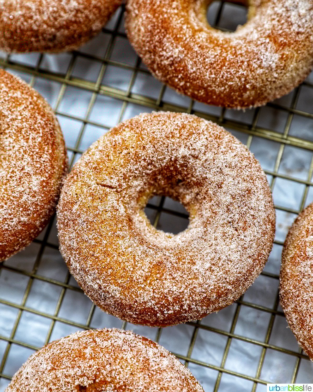 churro donuts on a cooling rack.