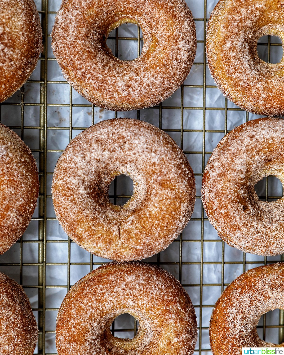 churro donuts on a cooling rack.