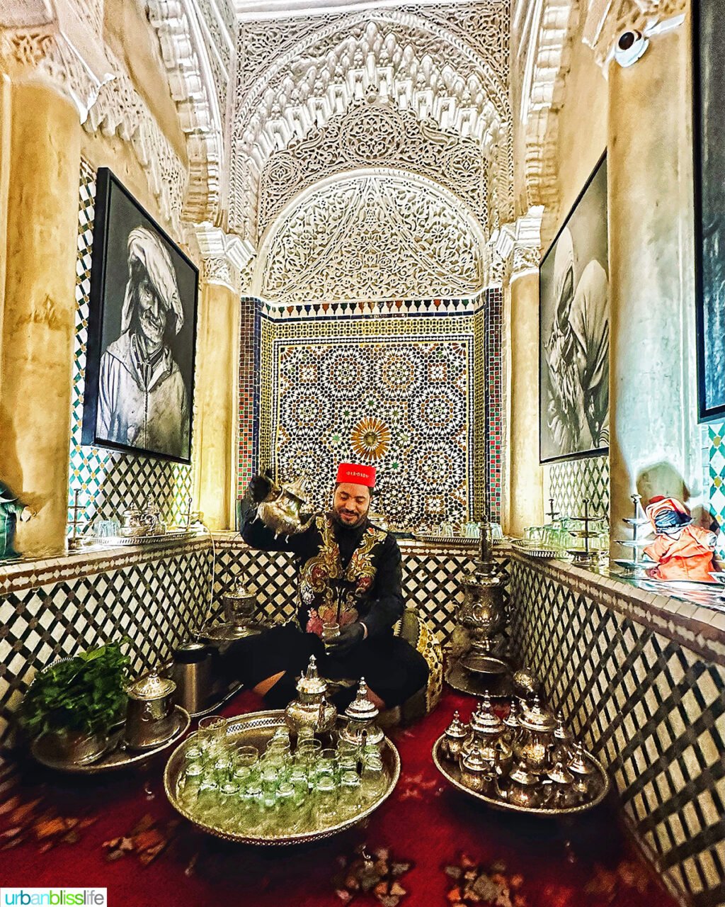 man pouring Moroccan mint tea at Dar Dada restaurant in Casablanca, Morocco.