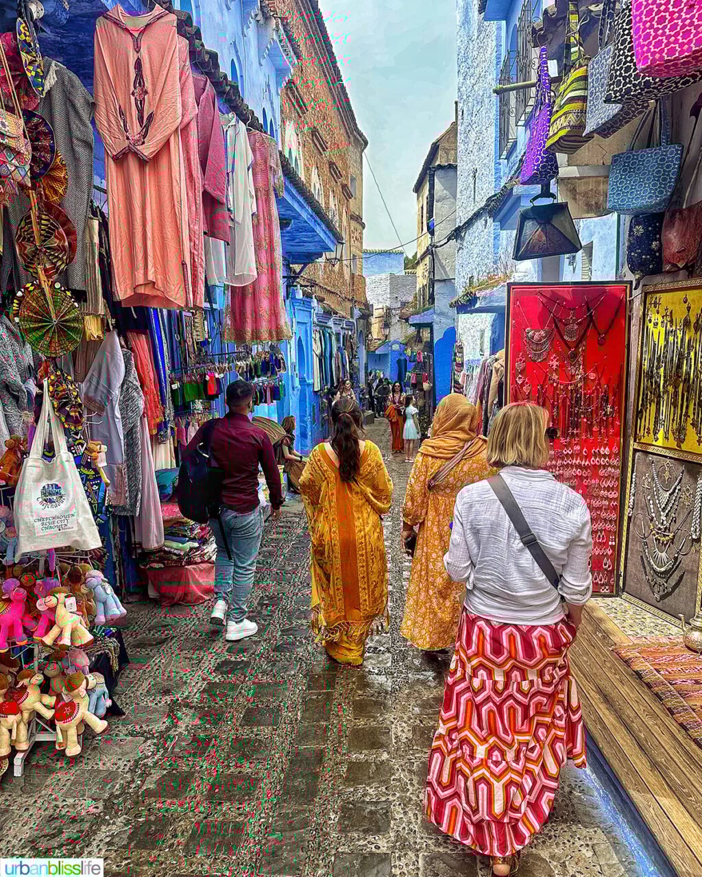 walking through alley of shops in Chefchaouen, the blue city, Morocco.