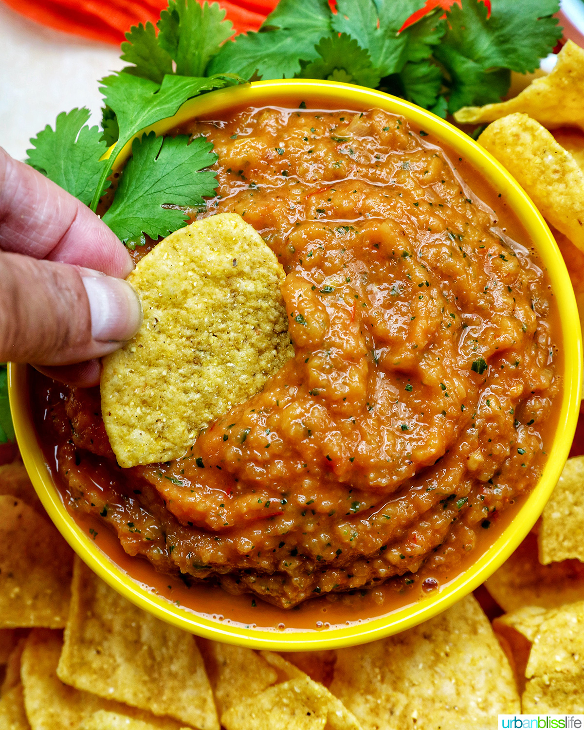 bowl of mango habañero salsa with tortila chips.