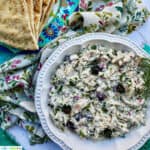 bowl of chicken tzatziki salad with side of pita bread.