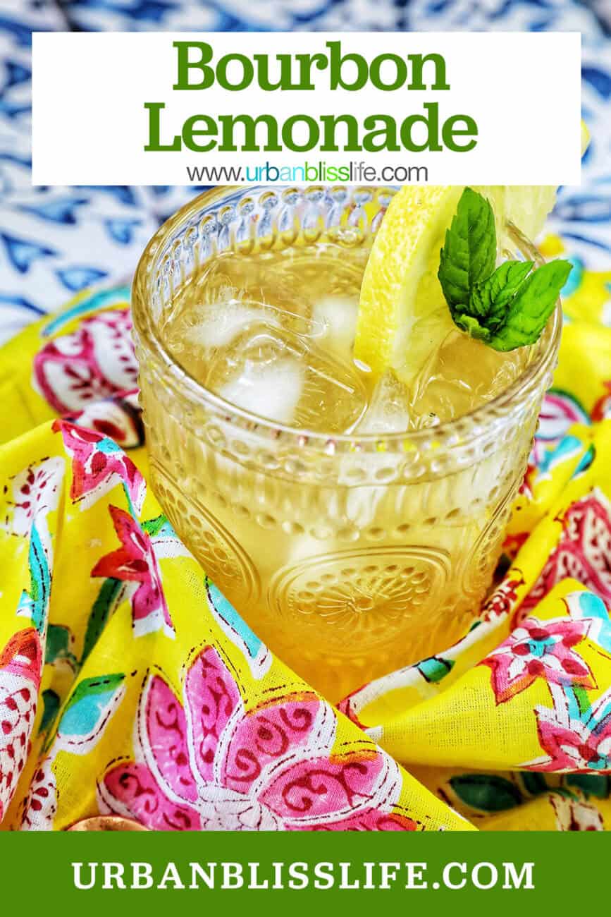 glass of bourbon lemonade on a bright colorful napkin with title text overlay.