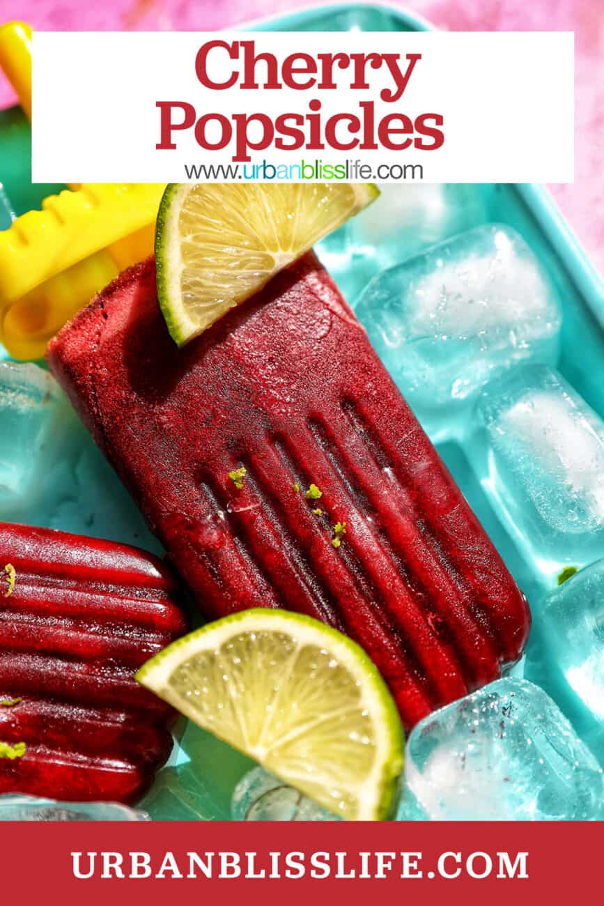 cherry popsicles on ice with slices of lime with title text overlay.