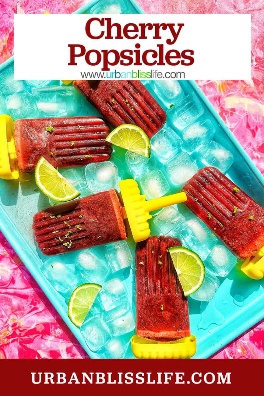 cherry popsicles on ice with slices of lime with title text overlay.