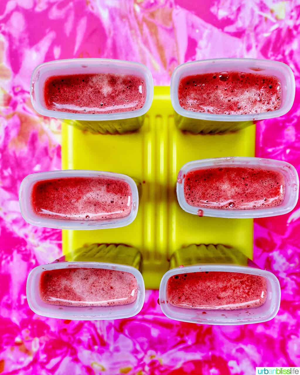 cherry popsicles in popsicle molds.