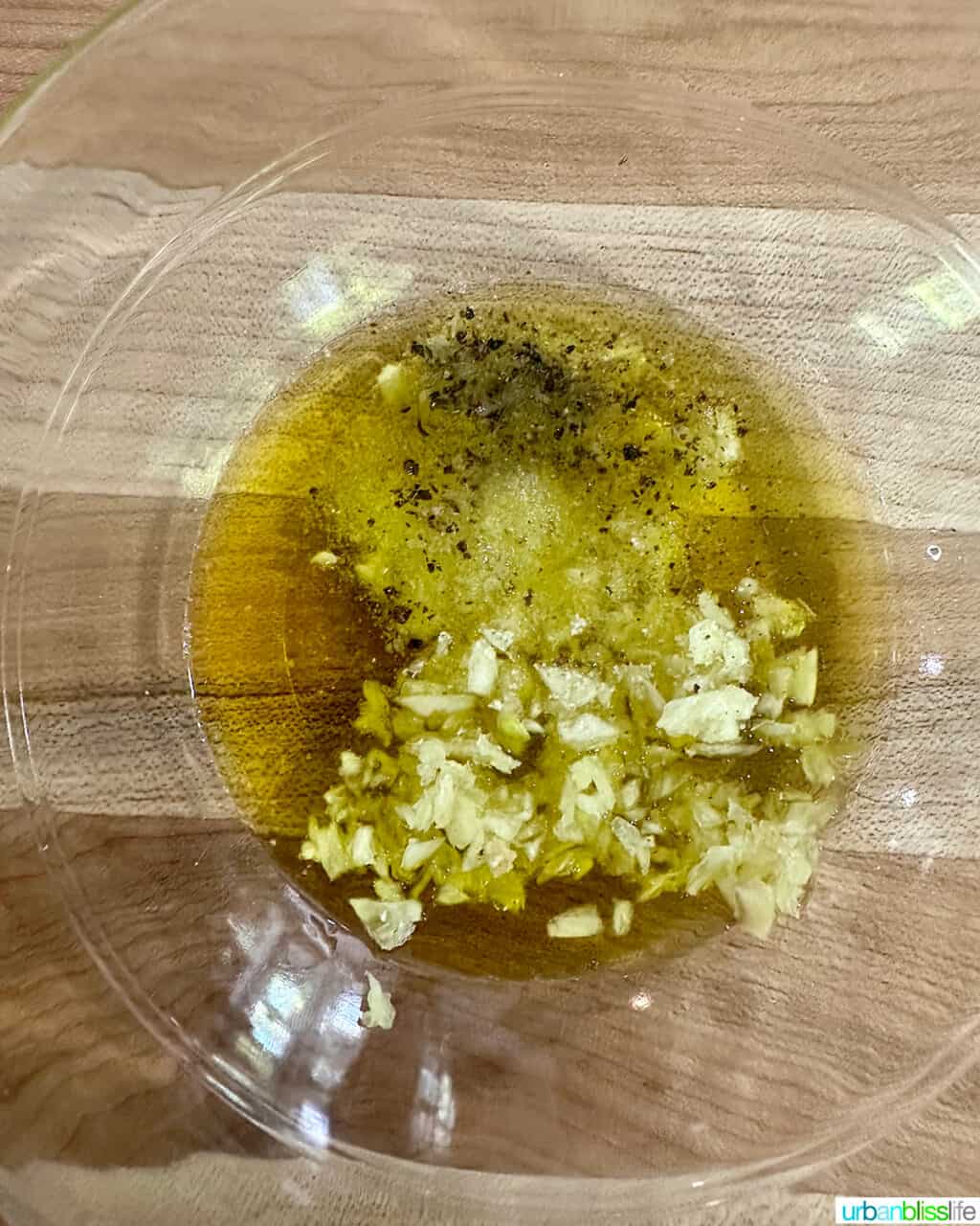 bowl of olive oil, garlic, and seasoning.