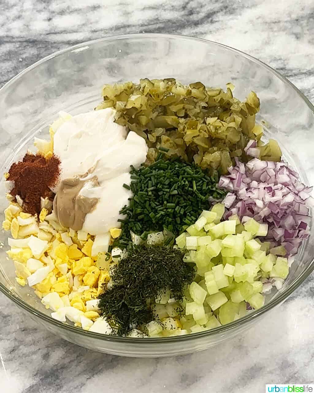 bowl of ingredients to make dill pickle egg salad.