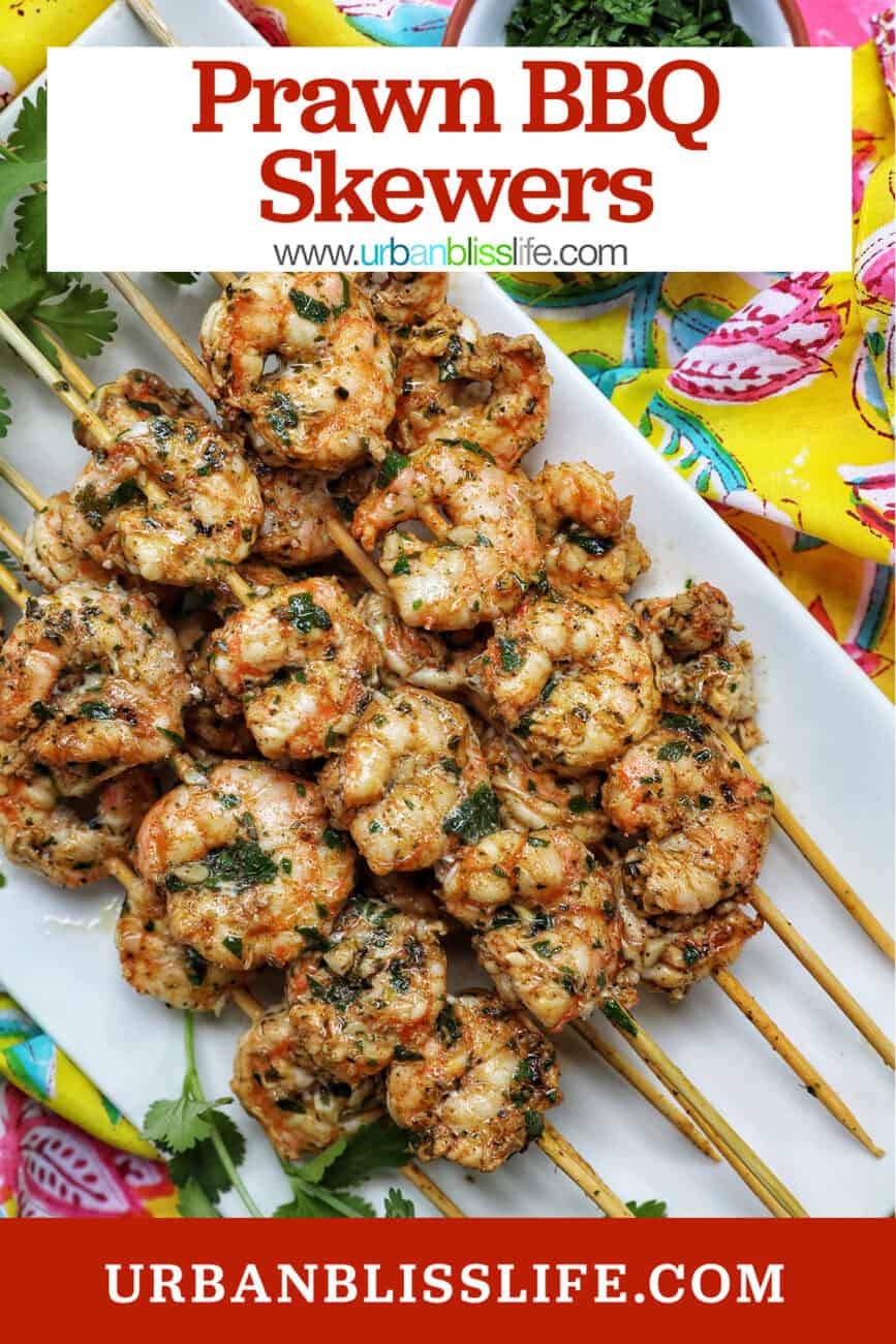prawn BBQ skewers stacked on a plate with title text overlay.