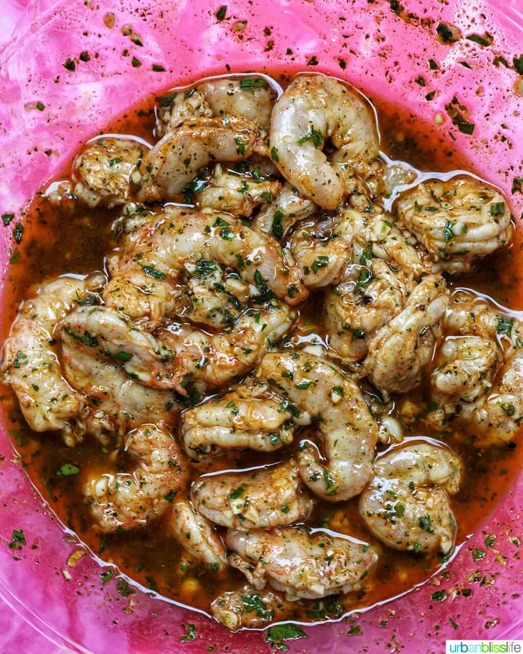 large shrimp marinating in marinade sauce.