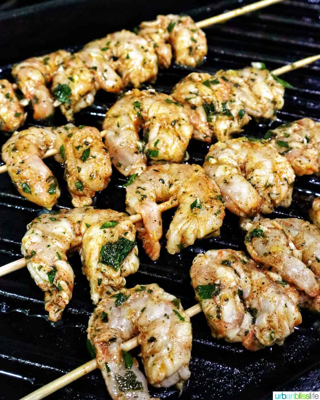 prawn BBQ skewers on a grill pan.