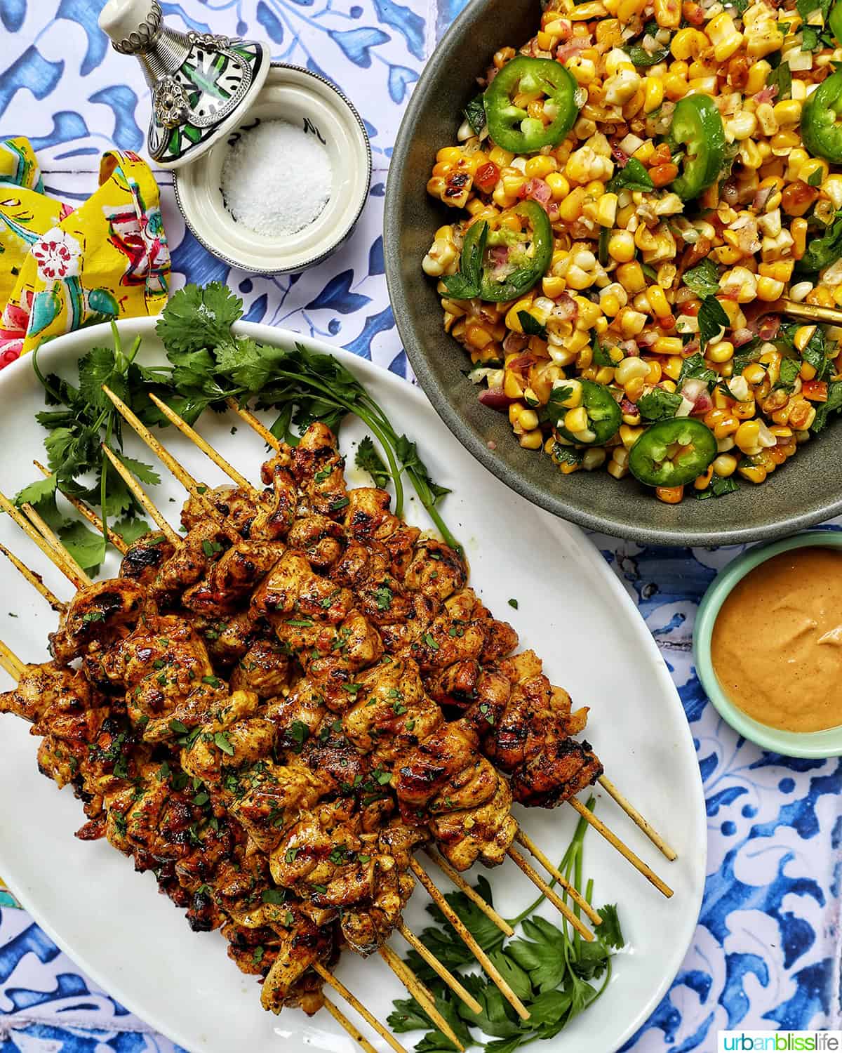 tandoori chicken skewers with charred corn salad and bourbon lemonade.
