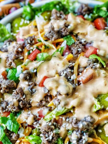 big bowl of Big Mac salad with toppings and Big Mac burger sauce dressing.