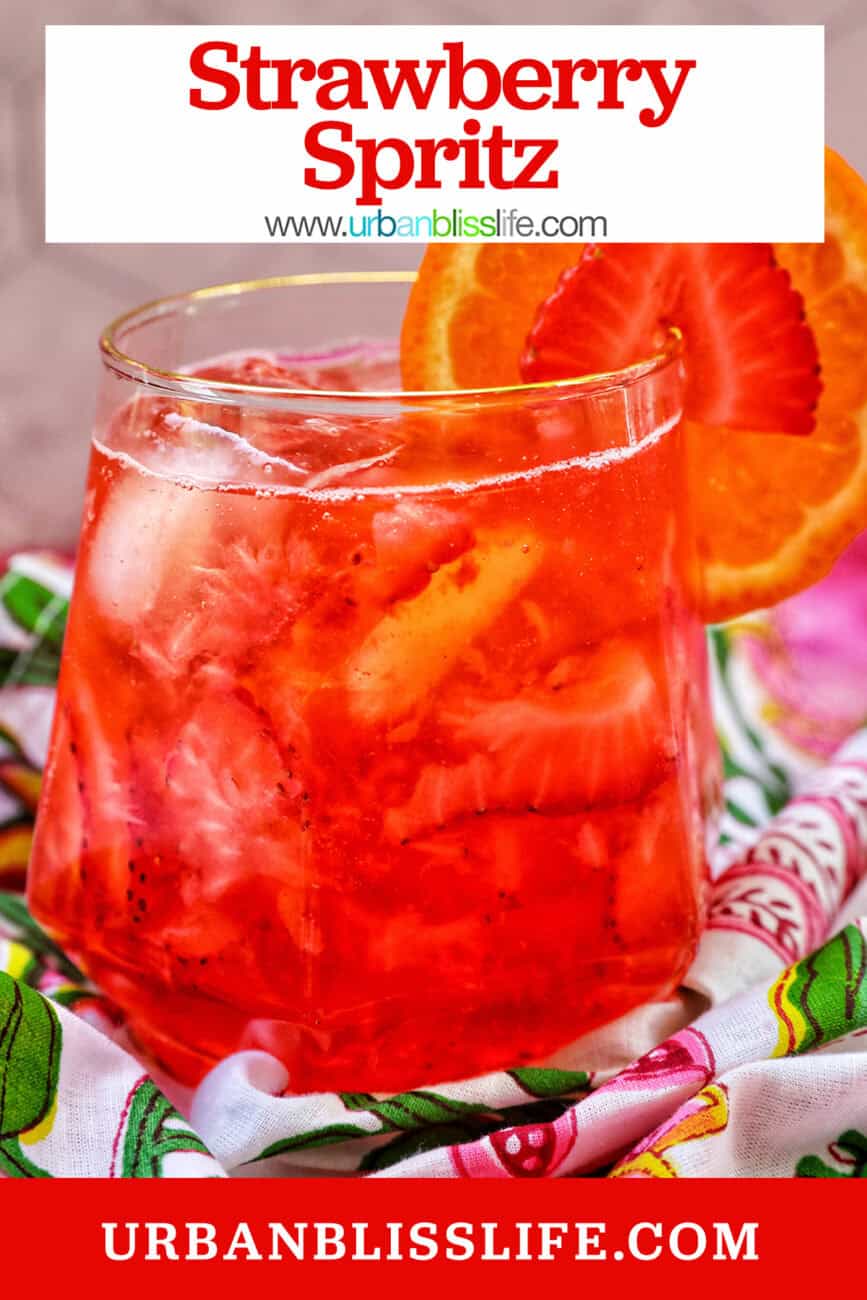 strawberry spritz with orange and strawberry garnish and title text overlay.