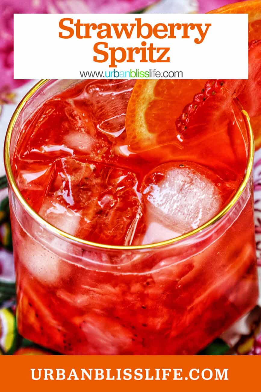 strawberry spritz with orange and strawberry garnish and title text overlay.
