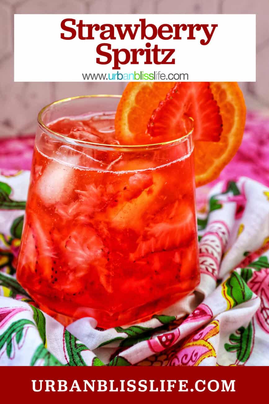 strawberry spritz with orange and strawberry garnish and title text overlay.