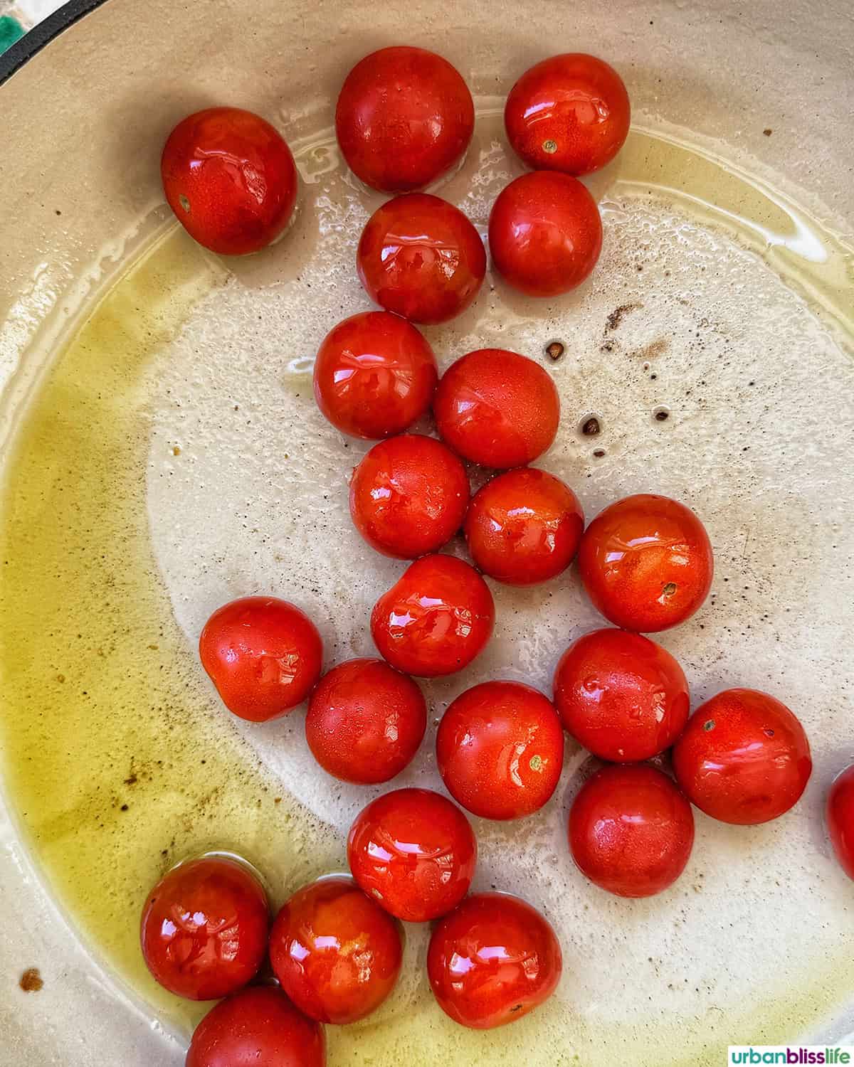cherry tomatoes in a skillet.