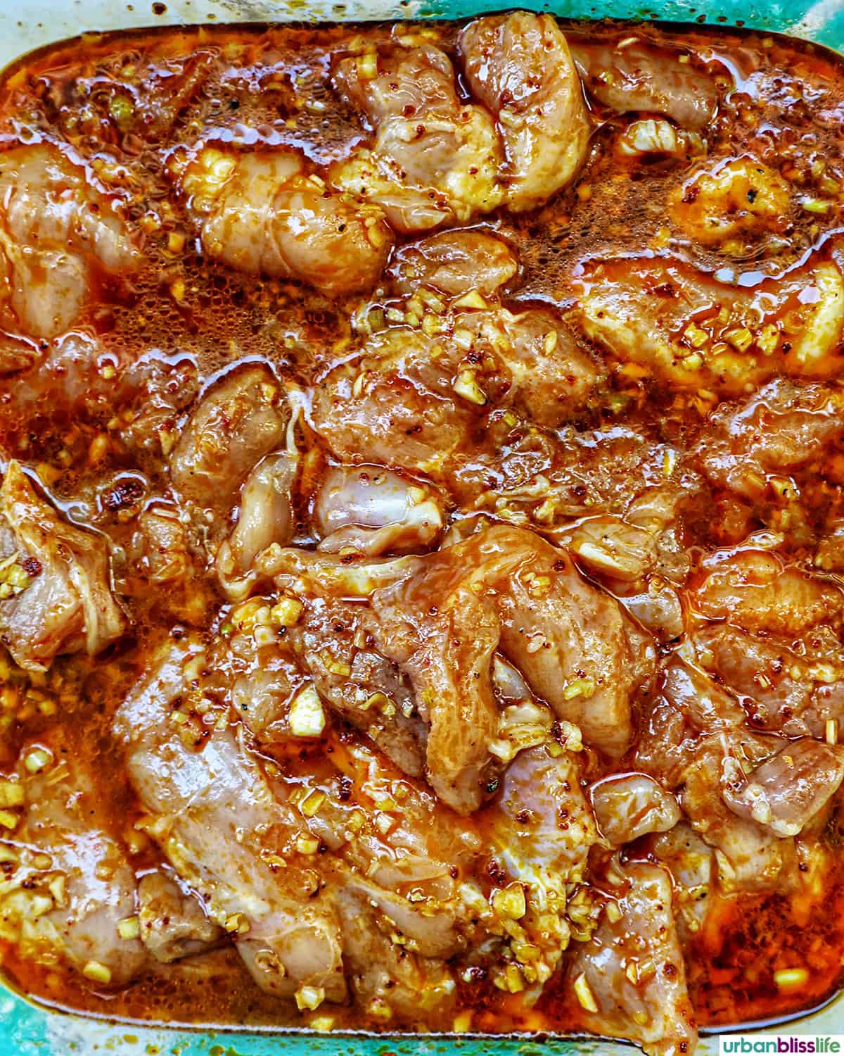 chicken marinating in inasal marinade.
