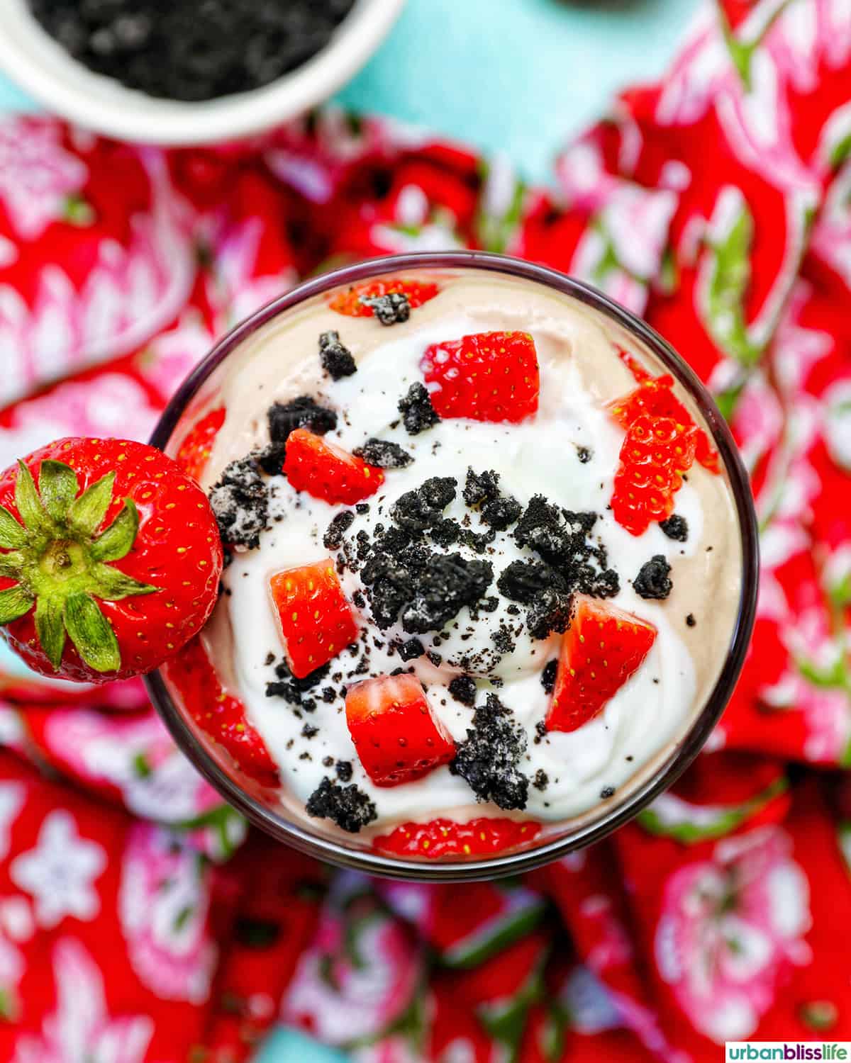 high protein chocolate parfait with strawberries, and  crushed oreos.