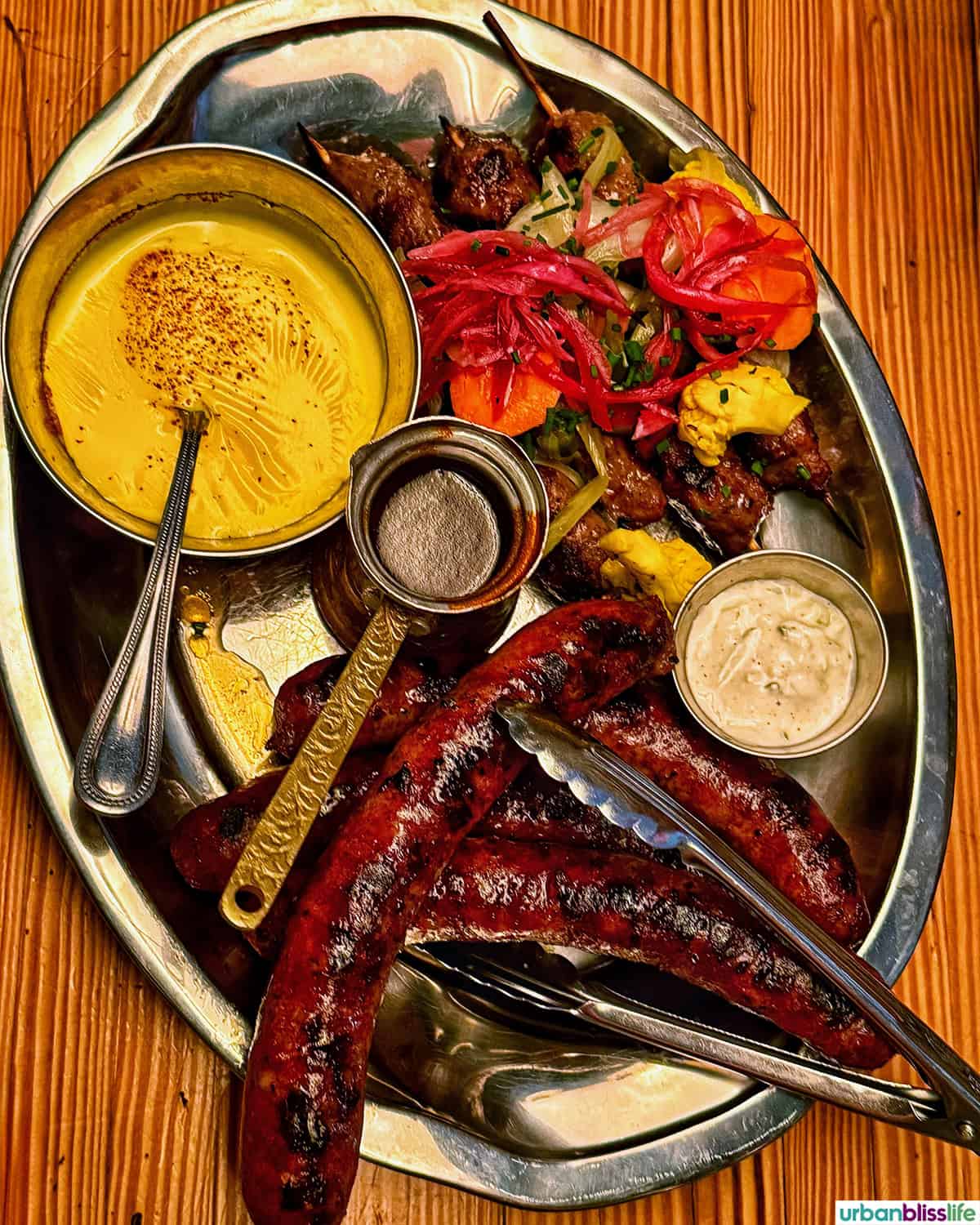 platter of smoked meats and sauces.